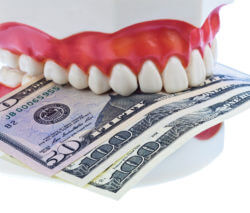 teeth model biting money